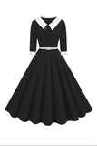 Vestido midi negro de manga corta con escote en V y línea A de la década de 1950