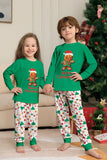 Verde conjunto de pijama familiar a juego navideño con estampado de Papá Noel.