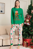 Verde conjunto de pijama familiar a juego navideño con estampado de Papá Noel.